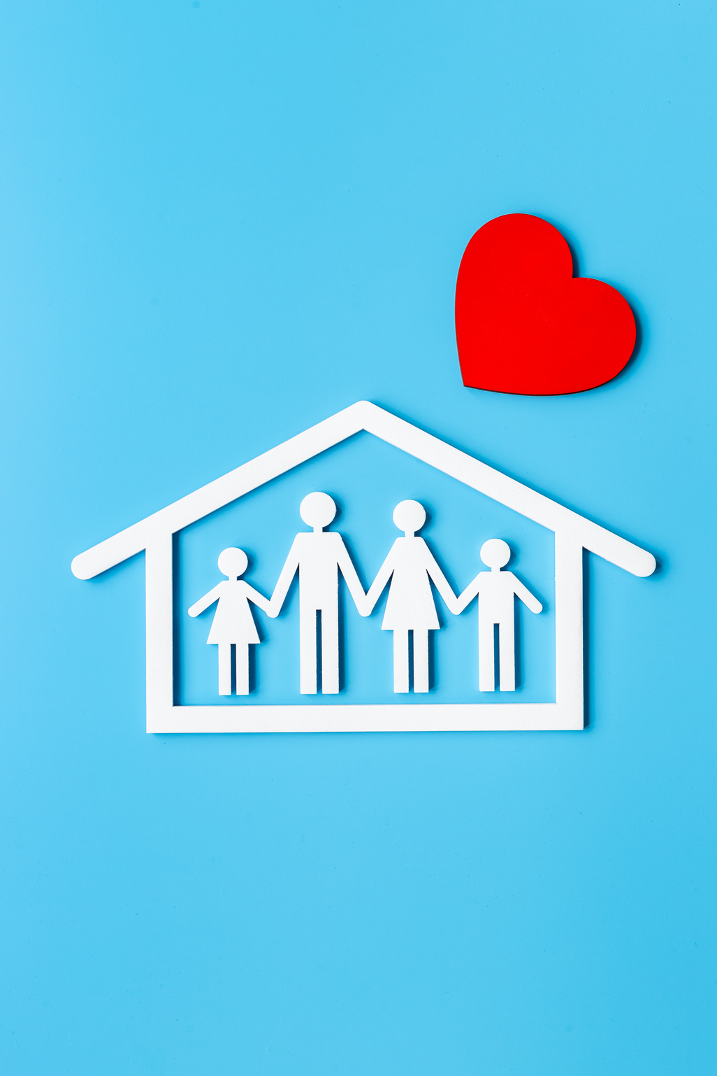 Family figure in house with heart. Happy family, protection and insurance concept